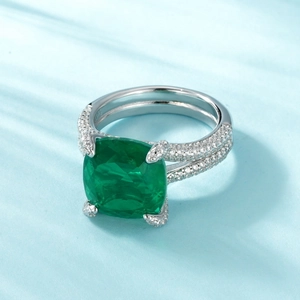 Luxurious S925 silver ring featuring emerald cut green gemstone and pave set zircon stones