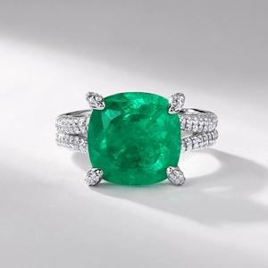 Luxurious S925 silver ring featuring a large cushion-cut emerald green gemstone with micro-pave diamonds