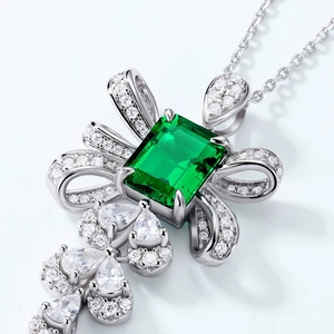 Bowknot emerald necklace in S925 silver with green gems and pear-shaped drop pendants