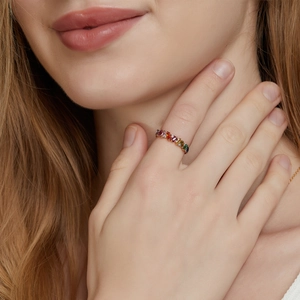 S925 silver 10K gold ring with rainbow zircon stones worn by a model in a close-up view