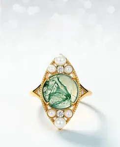 Detailed view of moss agate ring with freshwater pearls and rhombic sterling silver setting