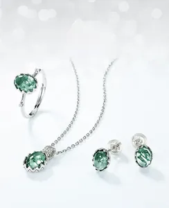 Macro detail of moss agate jewelry set featuring S925 silver necklace and matching ring