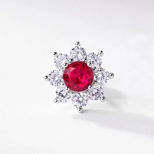 Elegant silver flower stud earrings with a red ruby center and white zircon accents