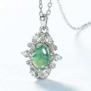 S925 silver necklace featuring a green moss agate pendant with a vintage hollow design
