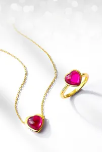 Detail of pink heart-shaped crystal ring and necklace set in gold-plated S925 silver