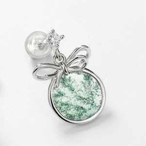 S925 silver stud earrings with moss agate and a delicate bowknot design in macro view