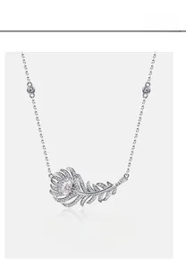 Macro view of feather pendant necklace with pink pear-cut carbon diamond in 925 silver