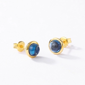 Elegant S925 sterling silver gold-plated stud earrings featuring round blue gemstones