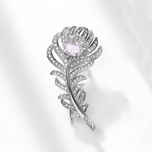 Elegant feather stud earrings with sparkling round diamonds in polished silver metal