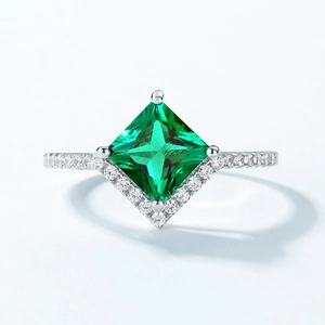 Elegant S925 silver ring featuring a princess cut emerald gemstone and pavé diamonds
