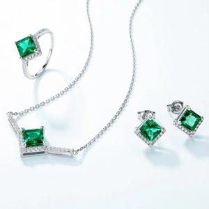 Luxurious S925 silver jewelry set featuring emerald-colored square cut gemstones and diamonds