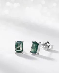 Macro detail of moss agate stud earrings featuring natural green textures and S925 silver