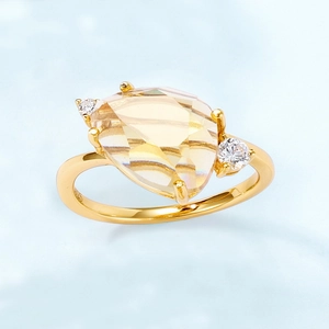 S925 silver ring with a large pear-cut yellow crystal and round side stones in gold finish