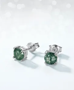 Macro shot of S925 silver stud earrings featuring round green moss agate with clear reflection