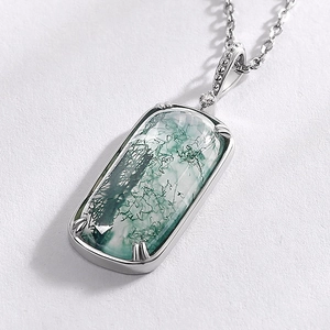 925 silver necklace with rectangular green moss agate pendant on white textured background