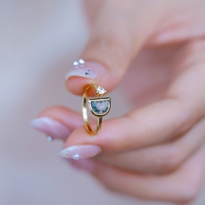 S925 silver gold-plated ring featuring natural green moss agate and round clear crystal