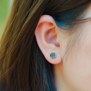 Natural green moss agate stud earrings in S925 silver setting worn on model ear