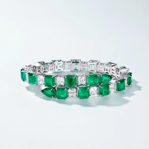 Luxury S925 silver bracelet with emerald-cut green gems and sparkling crystals