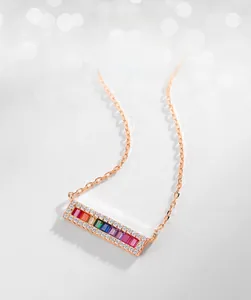 Macro shot of rectangular rainbow zircon necklace pendant in rose gold plated S925 silver