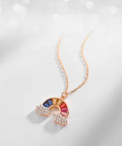 Close-up of S925 silver rainbow pendant with colorful zircon stones and rose gold chain