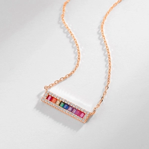 Rainbow gemstone pendant necklace in rose gold with colorful baguette-cut crystals