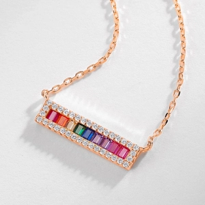 Rainbow gemstone pendant necklace in rose gold finish with zircon halo on white background
