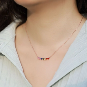 Rainbow zirconia triangle pendant necklace in S925 silver worn by a model in casual shirt