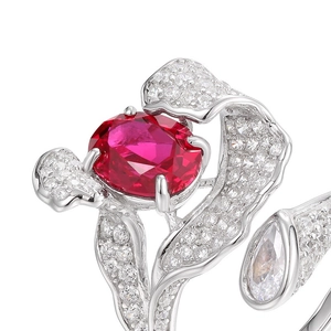 Irregular S925 silver ring with oval red gemstone and white diamond accents