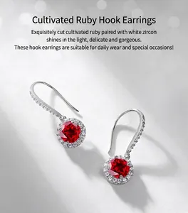 Detail of S925 silver ear hooks with blood red lab ruby and white zircon halo crystals