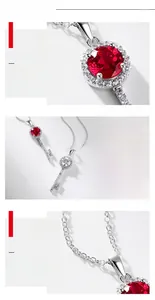 Macro detail of the S925 silver key pendant with lab-grown ruby and brilliant pavé diamonds