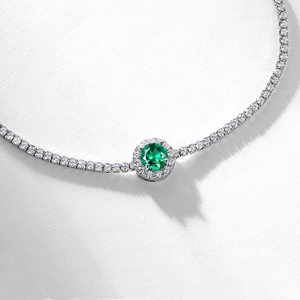 Luxurious S925 silver tennis bracelet featuring a green emerald halo round centerpiece