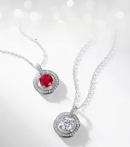 Macro shot of S925 sterling silver necklaces featuring round ruby and cubic zirconia