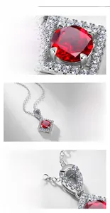 Macro detail of square lab-grown ruby pendant in S925 silver with diamond halo setting
