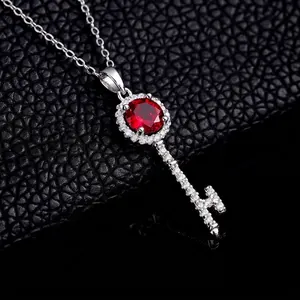 Luxurious S925 silver key necklace with a large round ruby and sparkling pavé setting