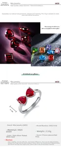 Macro detail of the silver bow ring featuring two vibrant heart-shaped red rubies