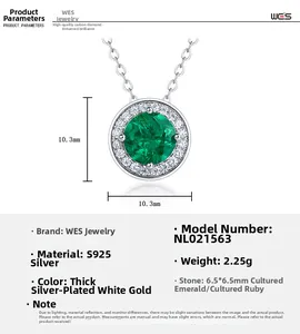 Detail view of round emerald pendant with silver chain showing precise dimensions