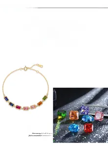 Macro detail of multicolored cubic zirconia stones on S925 gold-plated silver bracelet