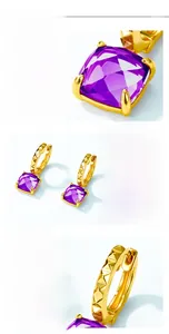 Macro shot of S925 silver gold-plated purple crystal earrings with secure four-prong setting