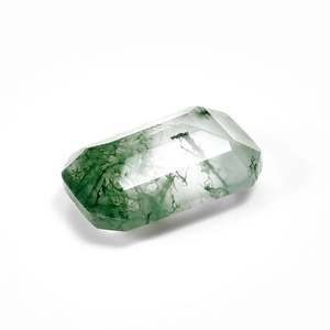 Macro view of emerald-cut natural moss agate gemstone with green moss-like patterns