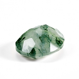 Detailed view of faceted oval moss agate gemstone with natural green moss-like inclusions