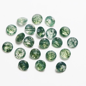Faceted round natural moss agate gemstones with unique green mineral inclusions on white
