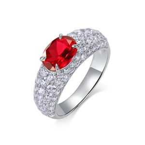 Luxury S925 silver ring featuring a large oval red gemstone and pavé diamond band