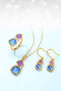 Close-up of S925 silver jewelry set with blue and purple square gemstones in gold finish
