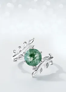 Detailed view of moss agate ring with S925 silver olive branch and leaf design