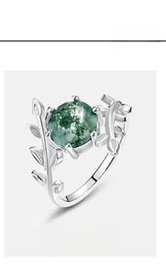Macro detail of S925 silver moss agate ring featuring olive branch and vine vine designs