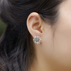 Elegant S925 silver olive branch stud earrings with natural moss agate stone on ear