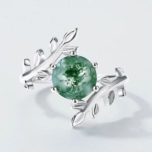 S925 silver ring featuring moss agate with organic vine leaf design on a grey background