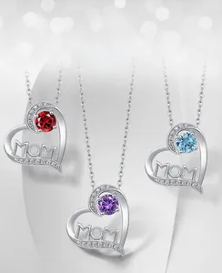 Detailed close-up of MOM heart necklaces with red, purple and blue birthstones in S925 silver
