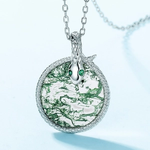 S925 silver coiled snake necklace featuring a round moss agate pendant and green gem eyes