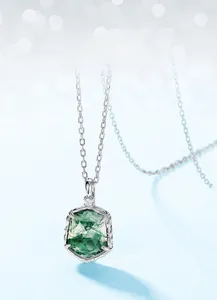 Macro shot of geometric moss agate pendant with natural green textures in S925 silver setting